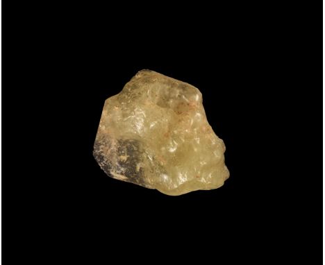 26 million years BP. A polished section of meteoric glass, the cut surface showing the distinctive inclusions and the exterio