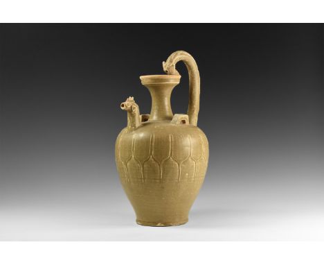 Song Dynasty, 960-1127 AD. A ceramic ewer with light olive glaze, barrel-shaped body with a band of scale detailing, broad sh