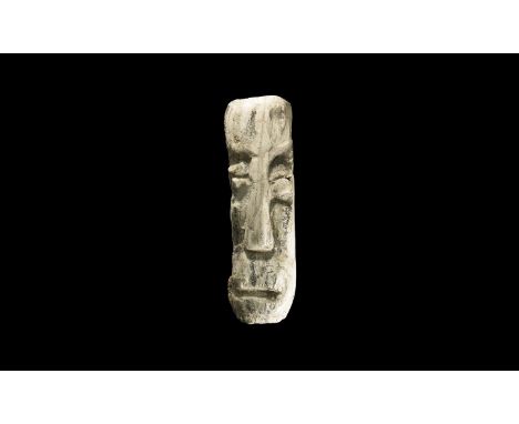 Pliocene Period, 5.2-2.5 million years BP. Mastodon fossil tusk from Island of Java with later carved with a face.  45 grams,