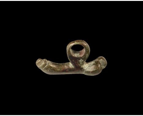 1st-2nd century AD. A bronze pendant in the form of a phallus with suspension ring above.  14 grams, 35mm (1 1/4"). Property 