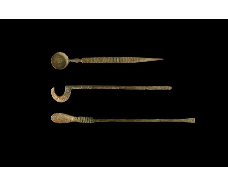 1st-3rd century AD. A goup of three bronze medical instruments consisting of: a instrument with long handle and hooked end; a