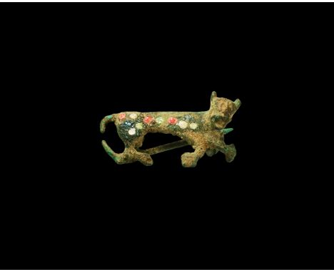 1st century AD. A bronze brooch in the form of a reclining panther with panel of enamel to the body with white, red and green