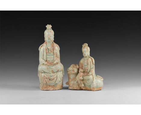 18th-19th century AD. A group of two green-glazed ceramic figures of Kwan-Yin, one sitting on a draped drum-shaped chair, the