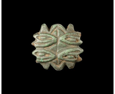Third Intermediate Period, 1069-702 BC. A large dark blue glazed composition amulet comprising four wedjat motifs on each bro
