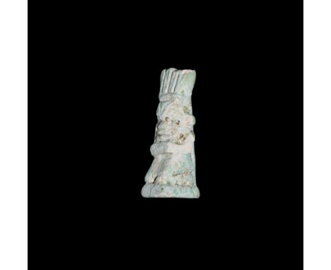 Late Period, 664-332 BC. A pale blue glazed composition amulet of Bes kneeling on a rectangular base, dorsal pillar, feather 
