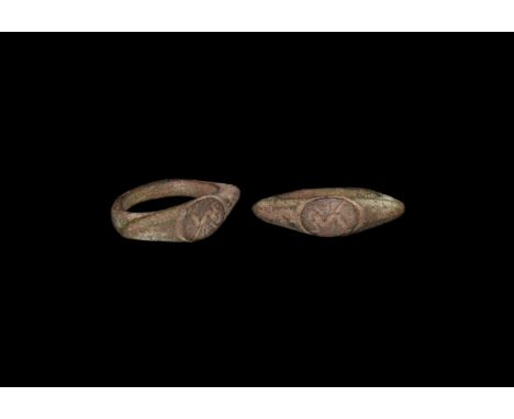 3rd-4th century AD. A bronze ring with round section hoop widening to the angled shoulder; small oval bezel engraved with the