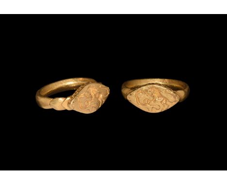 2nd-3rd century AD. A gold finger ring comprising a lentoid-section hoop with keeled pad to the underside, stepped shoulders,