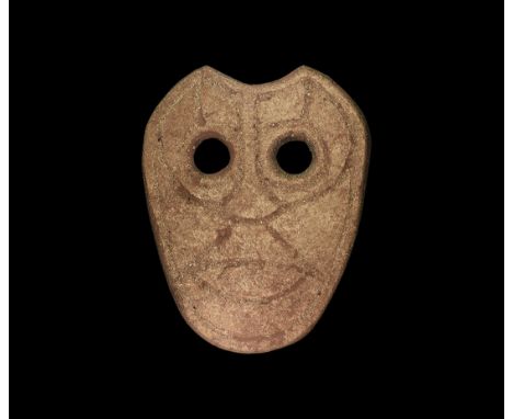 4th-3rd century BC. A ceramic funerary(?) mask with two eye-holes and incised intersecting curved lines. See discussion of ce