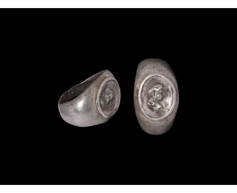 1st-3rd century AD. A silver ring with D-section hoop widening to the falt shoulder; oval section with cameo portrait of Alex