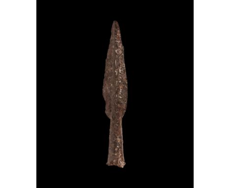 2nd-1st century BC. An iron spearhead with tapering socket forming a midrib, narrow leaf-shaped blade.  124 grams, 17.5cm (7"