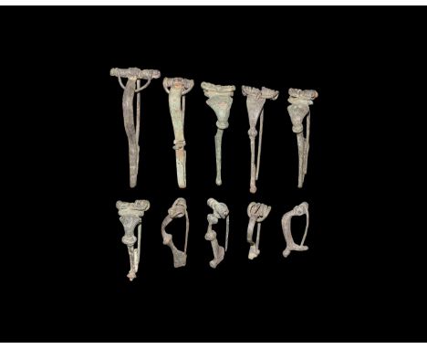 1st-2nd century AD. A mixed group of bronze bow brooches including trumpet, P-shaped and other types.  71 grams total, 32-64m