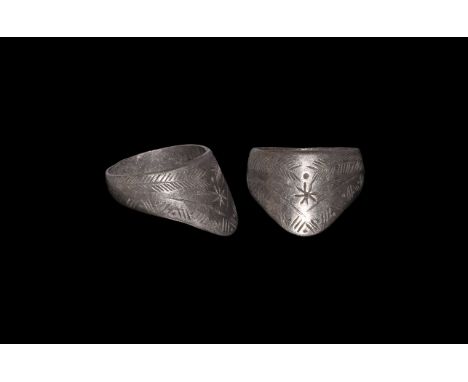 11th century AD. An archer's ring with a pointed and angled bezel; the band D-shaped in cross-section; the front of the bezel