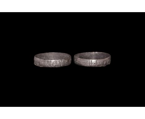 7th-10th century AD. A silver band ring engraved with Greek inscription and crosses.  0.99 grams, 15.62mm overall, 14.10mm in