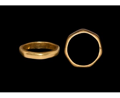 1st-3rd century AD. A gold finger ring D-shaped in section with flat lateral faces, seven facets. Cf. Chadour, A.B. Rings. Th