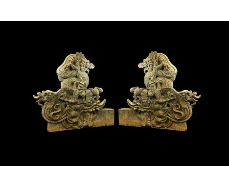 Qing Dynasty, 1644-1912 AD. A massive matched pair of ceramic dragon temple roof terminals, each formed in three sections com