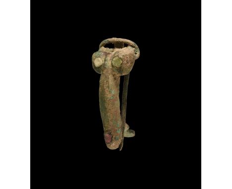 1st-2nd century AD. A bronze brooch in the shape of a phallus with red enamel inlay to the end of the phallus and white ename