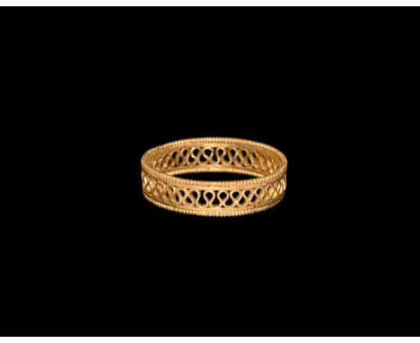 1st-2nd century AD. A gold finger ring formed as a meander filigree band with collars and beaded wire rims.  2.85 grams, 20mm