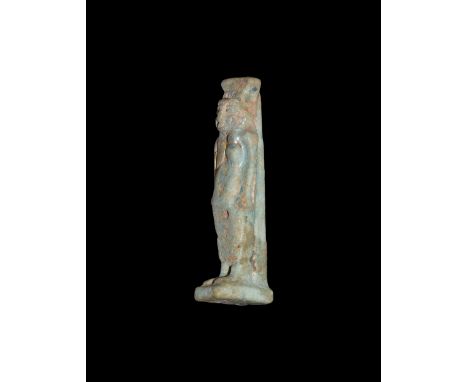 Third Intermediate Period, 1069-702 BC. A pale blue glazed composition amulet of Nepthys standing with rectangular base and d