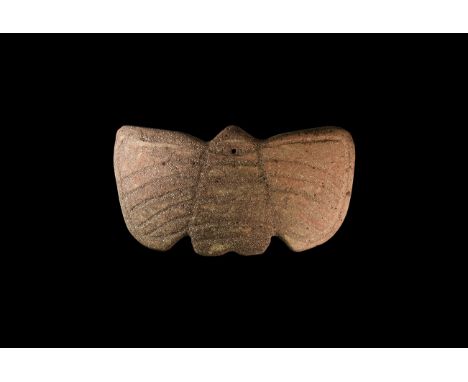 4th-3rd century BC. A slightly domed ceramic funerary(?) mask with incised linear butterfly detailing; attachment hole to the