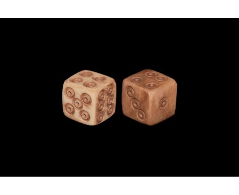 1st-4th century AD. A pair of bone dice engraved with ring-and-dot to each face for the numbers.  3.11 grams, 8mm (1/2"). Fro