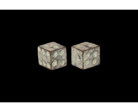 1st-4th century AD. A pair of bronze dice with engraved ring-and-dot motif to each face for numbers.  2.98 grams total, 6mm (