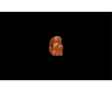 Old Kingdom, 2686-2181 BC. A carved carnelian amulet of a clenched fist. Cf. Andrews, C. Amulets of Ancient Egypt, London, 19
