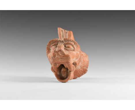 8th-5th century BC. A ceramic vessel spout in the form of a Sirrush, with arched eyebrows, flaring nostrils and gaping mouth 