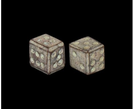 1st-4th century AD. A pair of bronze dice engraved with ring and dot motif to each side for numbers.  8.95 grams total, 8mm (