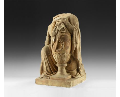 19th century AD or earlier. A solid stone kneeling figure on a square base, with draped cloak clasping an oval urn with ribbo