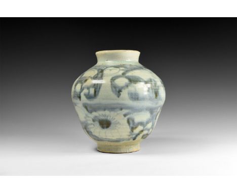 Yuan Dynasty, 1271-1368 AD. A ceramic jar with stepped bulbous profile, basal ring and flared chamfered rim; white to pale bl