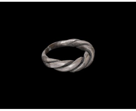 10th-12th century AD. A silver round-section twisted ring with joined tapering shanks. Sedov, B.B. Finno-Ugri i Balti v Epokh