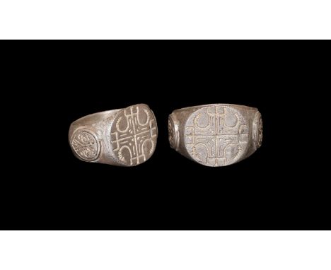 8th-10th century AD. A silver ring with D-section hoop, knop to the middle, widening to shoulder with tear drop shaped panel 