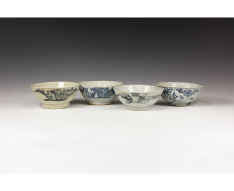 19th century AD. A group of four glazed ceramic bowls each with basal ring, blue floral motifs to the outer face.  1.1 kg, 15