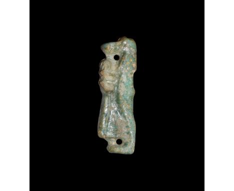 Late Period, 664-332 BC. A dark green glazed composition amuletic figure of baboon-headed Hapi holding a sceptre in front of 