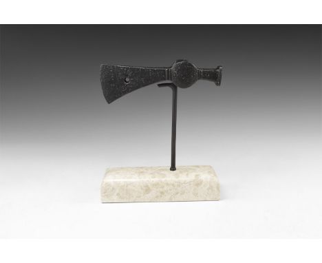 11th-13th century AD. A hand-forged iron axehead with triangular-section narrow blade extending to a narrow curved edge, pier