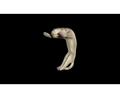 1st-2nd century AD. A bronze vessel handle in the form of a panther with arching body, lower legs together with tail arching 