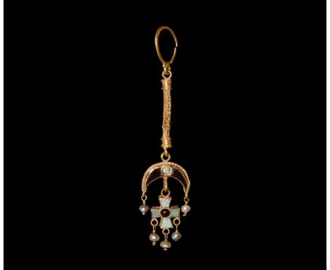 5th-8th century AD. A gold hoop with length of trichinopoly chin supporting a crescent cell with glass and enamel crescent an
