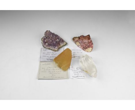 . A mixed group comprising: a geode fragment with amethyst crystals from Brazil; a large calcite crystal from Kansas, USA; a 