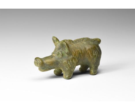 2nd-3rd century AD. A substantial bronze figure of a boar, standing on short legs; large muzzle and ears, detailing to the fu
