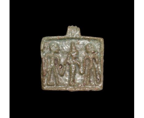 Third Intermediate Period, 1069-702 BC. A rectangular green glazed composition plaque with three raised figures, the goddess 