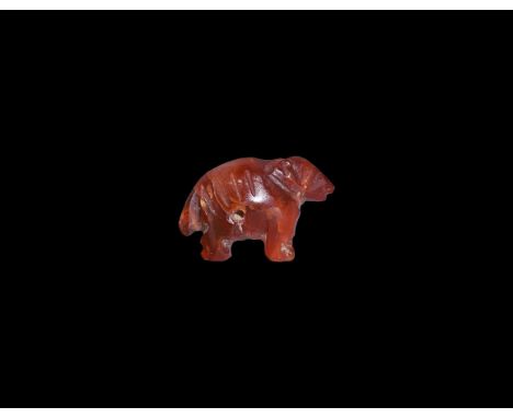 Third Intermediate Period, 1069-702 BC. A carved carnelian amuletic pendant of a standing ram. Cf. Andrews, C. Amulets of Anc