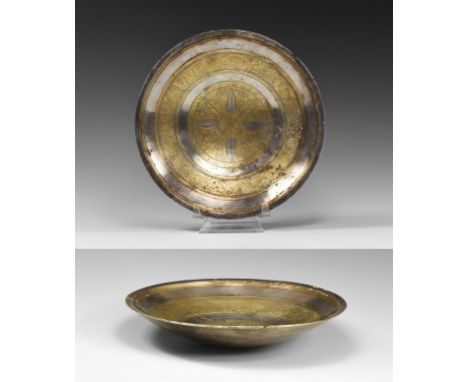 2nd-1st century BC. A shallow silver dish with thickened chamfered rim, concentric gilt bands, one with reserve scrolled vine