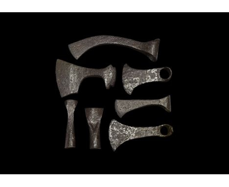 9th-11th century AD. A mixed group of iron items comprising of: a bearded axehead with triangular-section blade, square chin 