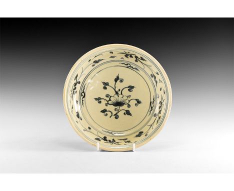 19th century AD. A tin-glazed ceramic bowl with painted arcading to the exterior, central flower spray to the inner face with