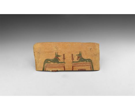 Late Period, 664-332 BC. A rectangular wooden panel with finely painted scene of two opposed figures of Anubis in the form of