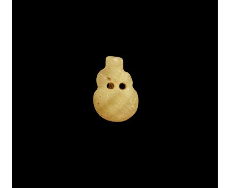 Ptolemaic Period, 332-30 BC. A carved calcite alabaster ram's head amulet with drilled eyes. Cf. Flinders Petrie, W.M. Amulet