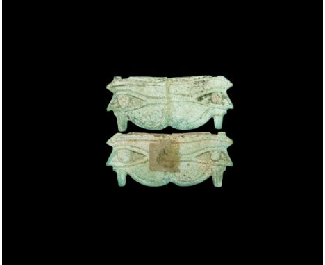 Third Intermediate Period, 1069-702 BC. A white and pale blue glazed composition bifacial amulet comprising two incised wedja