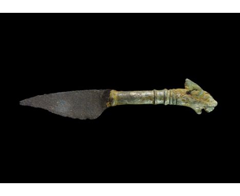 2nd-3rd century AD. A single-edge iron blade with curved back, tubular silver handle with ribs, finial formed as the head of 