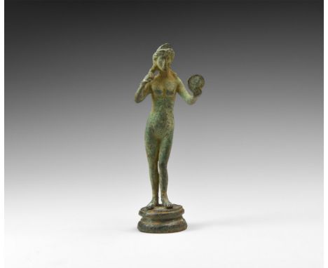 1st-2nd century AD. A bronze figure of Venus (Aphrodite) naked and with hair parted in the centre and falling to the shoulder