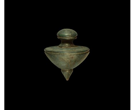1st-3rd century AD. A bronze plumb bob, conical in profile with flared edge, biconvex knop above.  145 grams, 45mm (1 3/4"). 